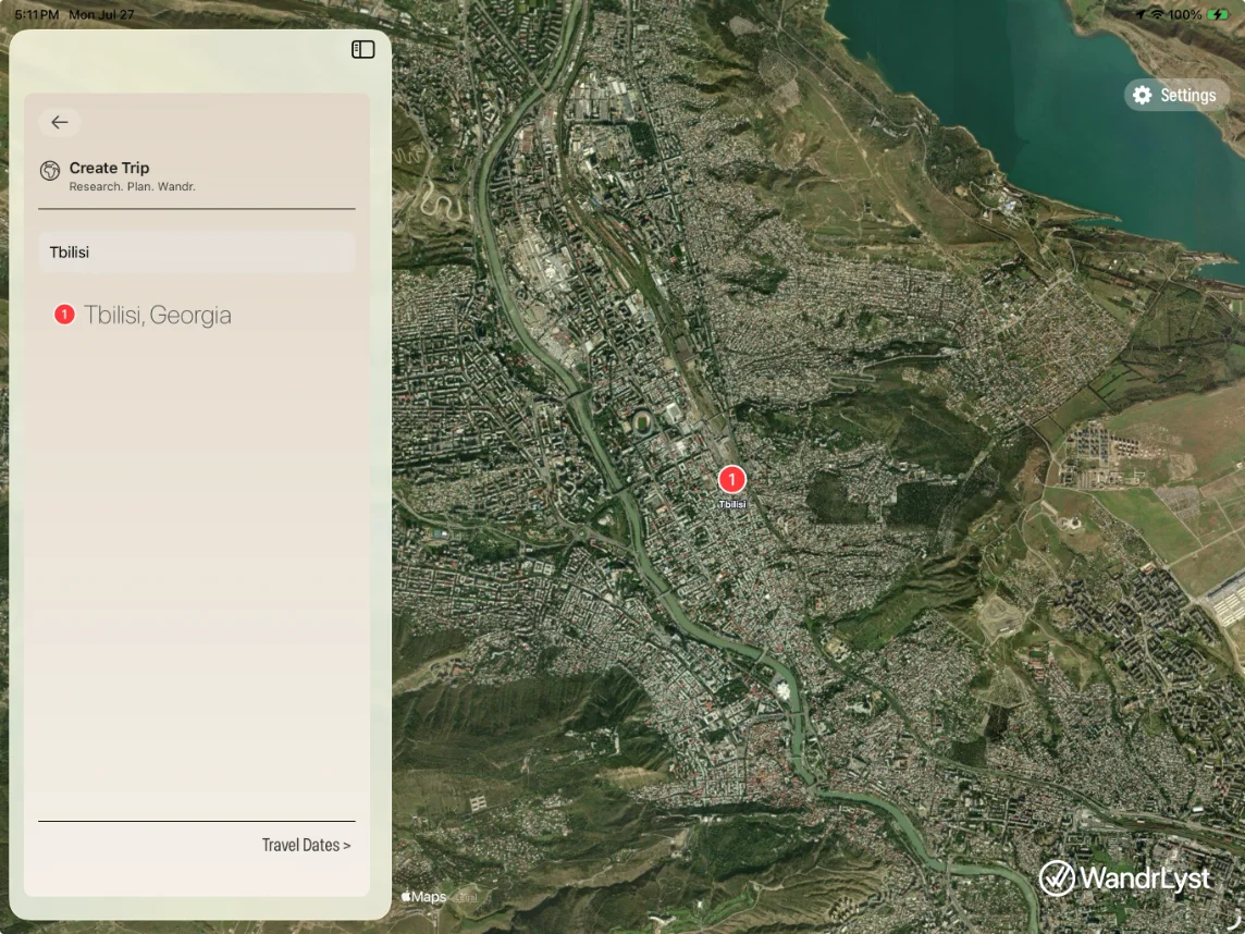 Creating a trip in WandrLyst on iPad — searching for Tbilisi, Georgia, with the city located on a satellite map.